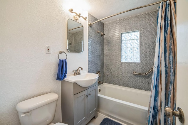 full bathroom with vanity, toilet, and shower / tub combo with curtain