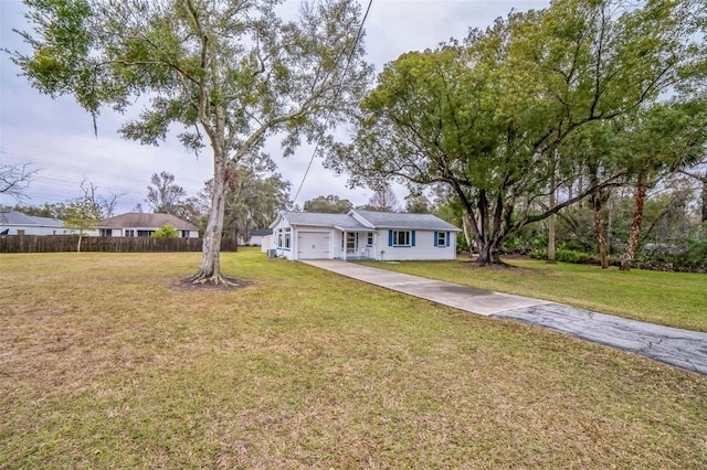 view of front facade with a garage and a front yard