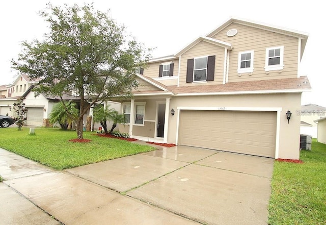 view of front of house featuring a garage, a front yard, and central AC unit