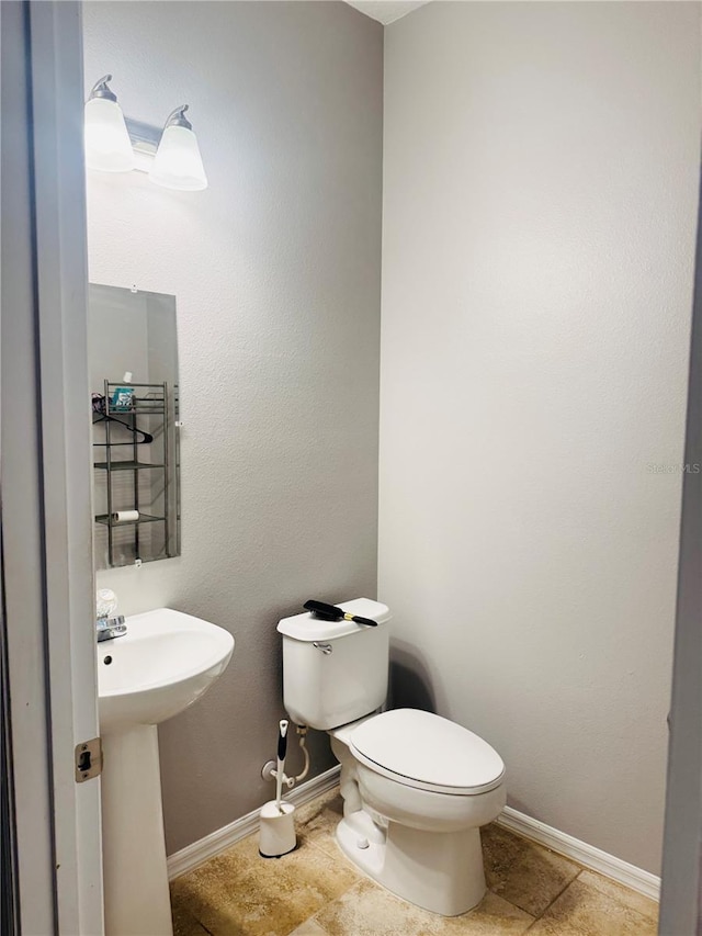 bathroom featuring sink and toilet