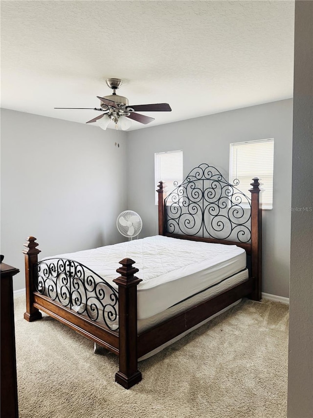 bedroom featuring ceiling fan and carpet floors