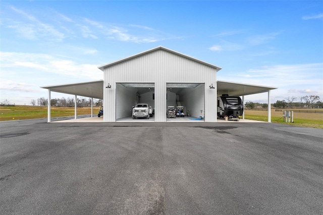 view of car parking with a carport and a garage