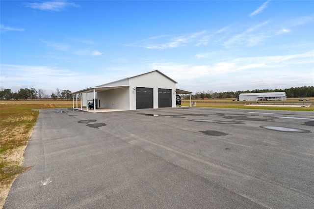 exterior space featuring a garage and a carport