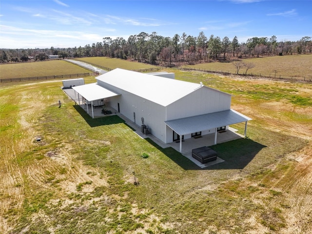 birds eye view of property with a rural view