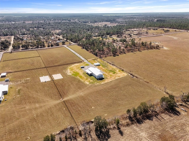 birds eye view of property featuring a rural view