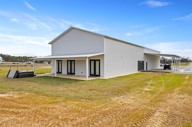 rear view of property with a yard