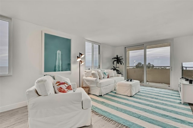 living room featuring floor to ceiling windows