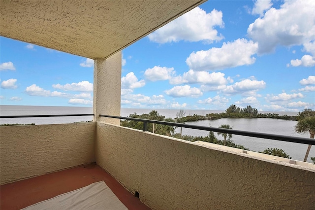 balcony featuring a water view