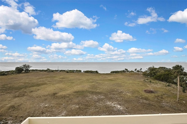 view of landscape with a water view