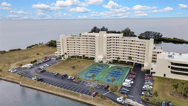 birds eye view of property with a water view