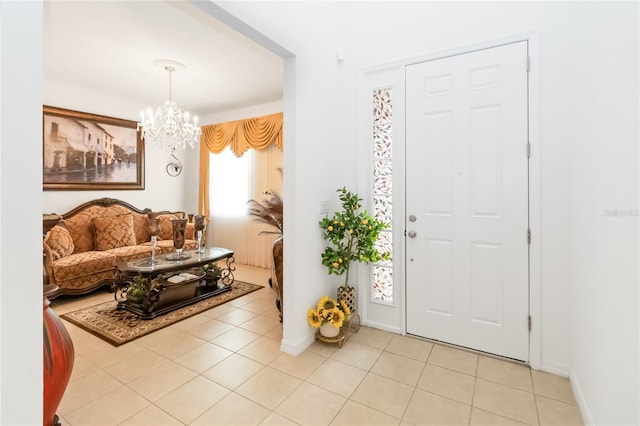 foyer entrance featuring an inviting chandelier and light tile patterned floors