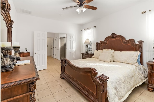 tiled bedroom featuring ceiling fan