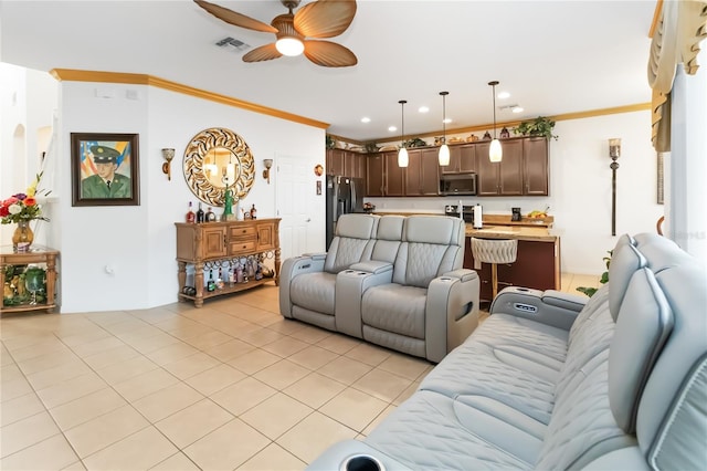 tiled living room featuring crown molding and ceiling fan