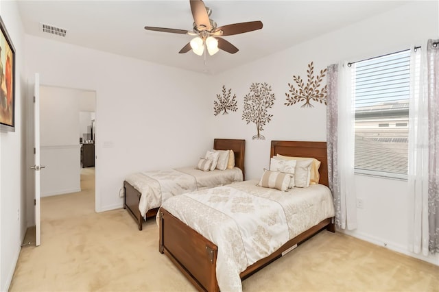 bedroom with light carpet and ceiling fan