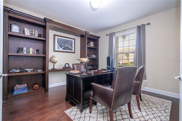 home office featuring dark hardwood / wood-style flooring