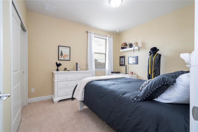 carpeted bedroom with a closet