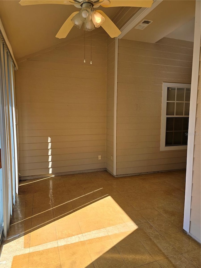 unfurnished sunroom with vaulted ceiling and ceiling fan