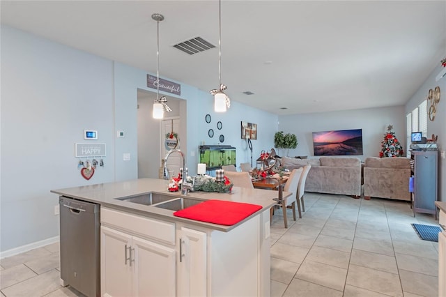 kitchen with sink, hanging light fixtures, dishwasher, an island with sink, and white cabinets