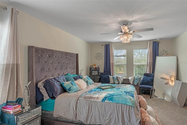 bedroom featuring ceiling fan and carpet flooring