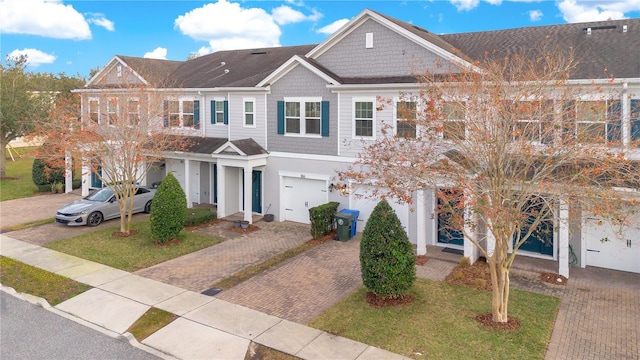 view of front of home featuring a garage and a front lawn