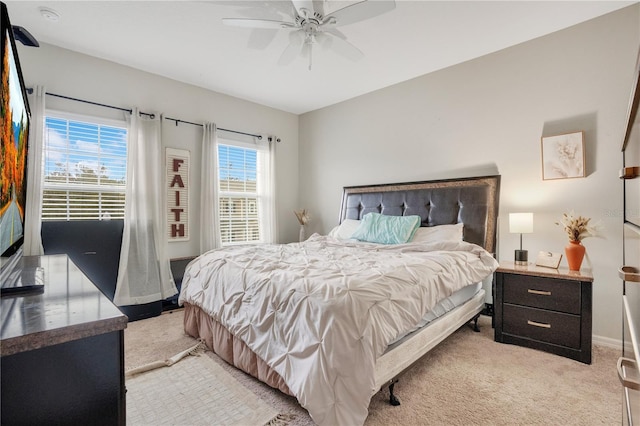 bedroom with light colored carpet and ceiling fan