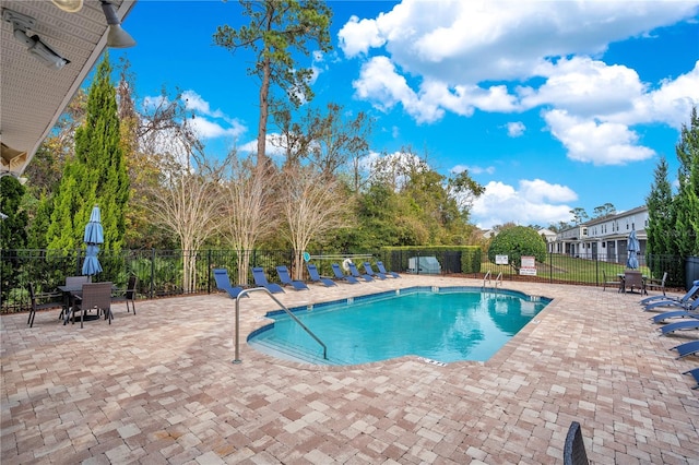 view of swimming pool featuring a patio area