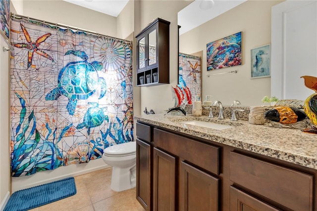 full bathroom featuring vanity, toilet, tile patterned flooring, and shower / bath combo