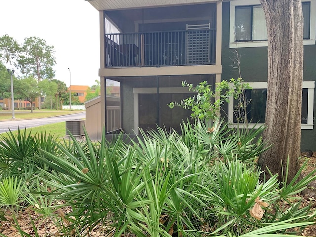 exterior space with cooling unit and a balcony