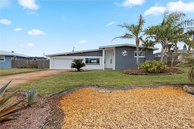 view of front facade featuring a garage and a front lawn