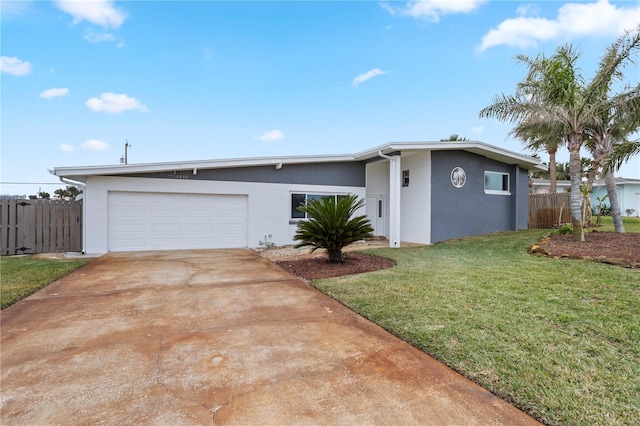 ranch-style house featuring a garage and a front lawn