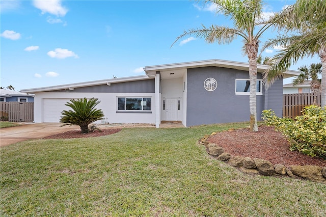 ranch-style home with a garage and a front yard