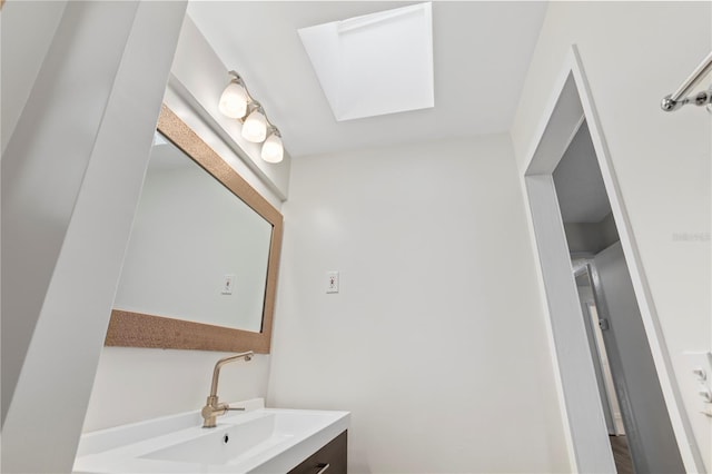 bathroom with vanity and a skylight