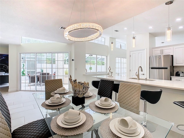 tiled dining space featuring sink