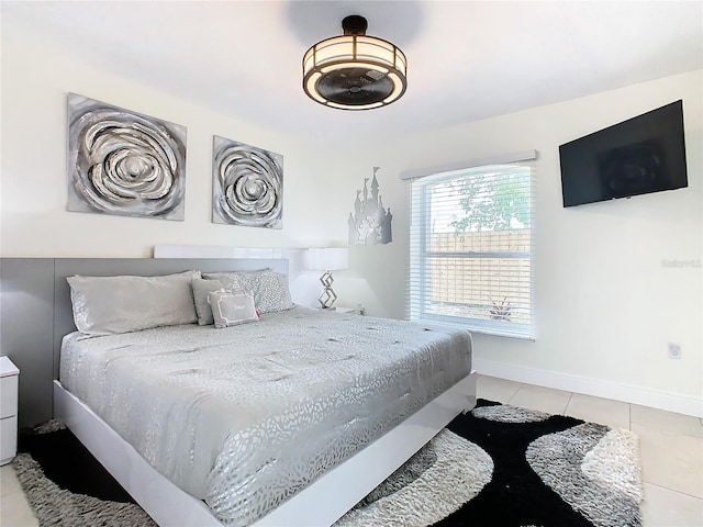 bedroom featuring light tile patterned flooring