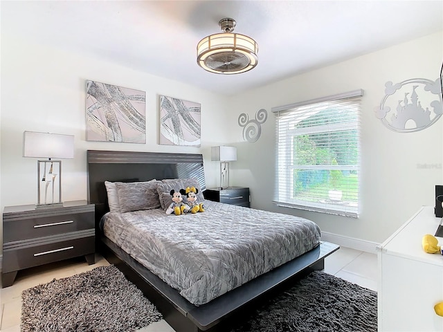 bedroom featuring light tile patterned floors