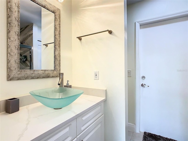 bathroom with vanity and tile patterned flooring