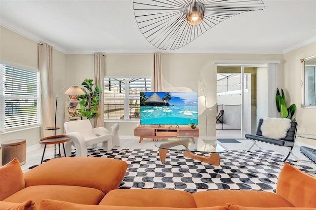 living room with crown molding, plenty of natural light, and carpet flooring