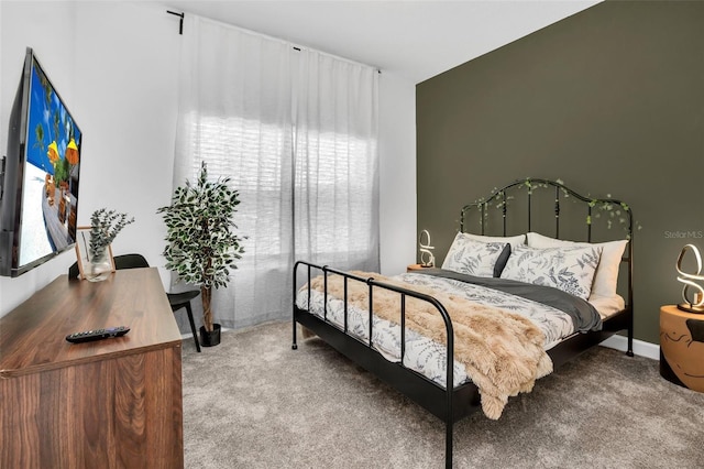 carpeted bedroom featuring multiple windows