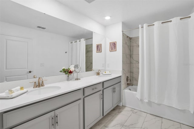 bathroom with vanity and shower / tub combo with curtain