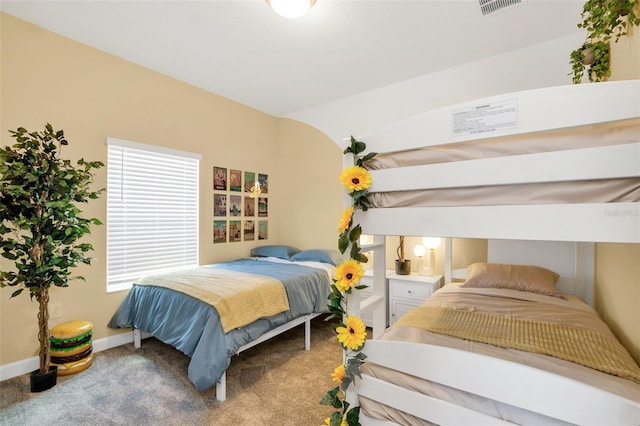 bedroom with lofted ceiling and carpet