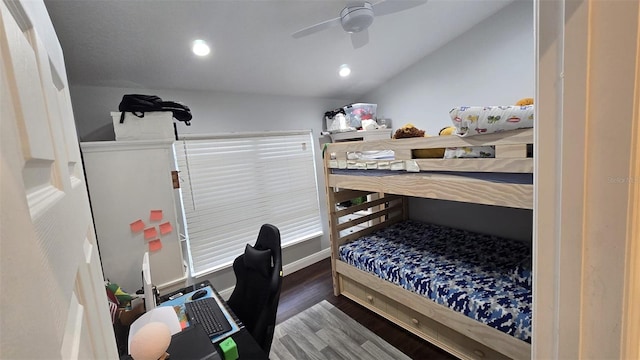 bedroom featuring ceiling fan, lofted ceiling, and dark hardwood / wood-style flooring