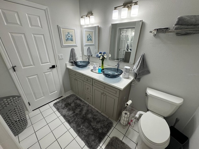 bathroom with vanity, tile patterned floors, and toilet