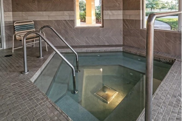 view of pool featuring an indoor in ground hot tub