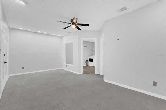 spare room featuring carpet, visible vents, baseboards, recessed lighting, and ceiling fan