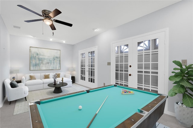 recreation room featuring french doors, carpet, visible vents, and ceiling fan