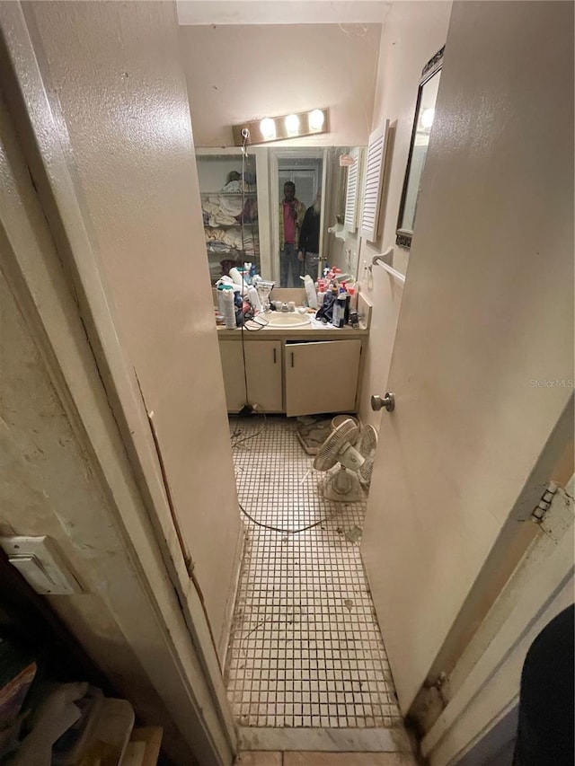 bathroom with tile patterned flooring and vanity