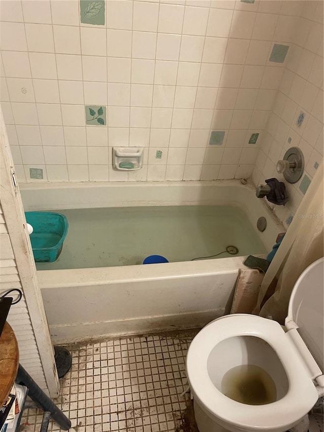 bathroom with tile patterned floors