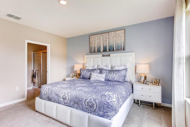 bedroom featuring light colored carpet