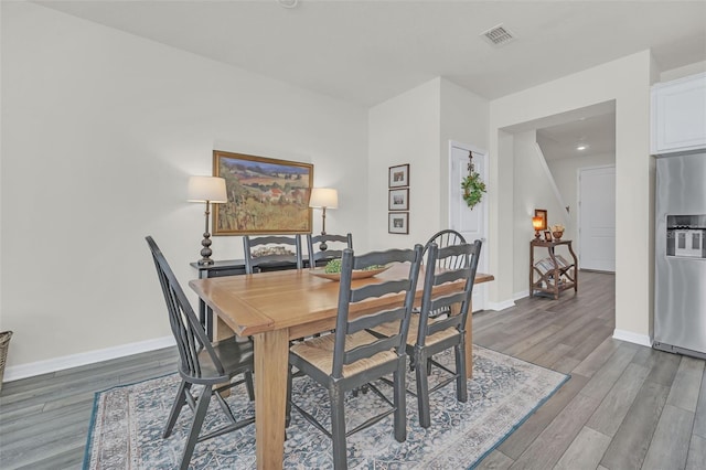 dining area with wood-type flooring