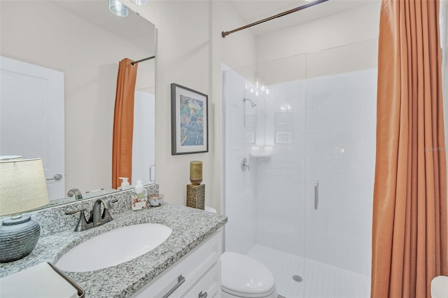 bathroom with vanity, toilet, and curtained shower